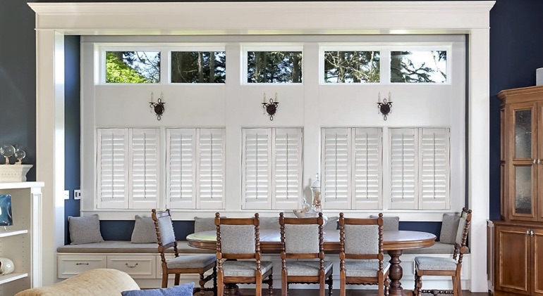 Sacramento dining room with shut plantation shutters.